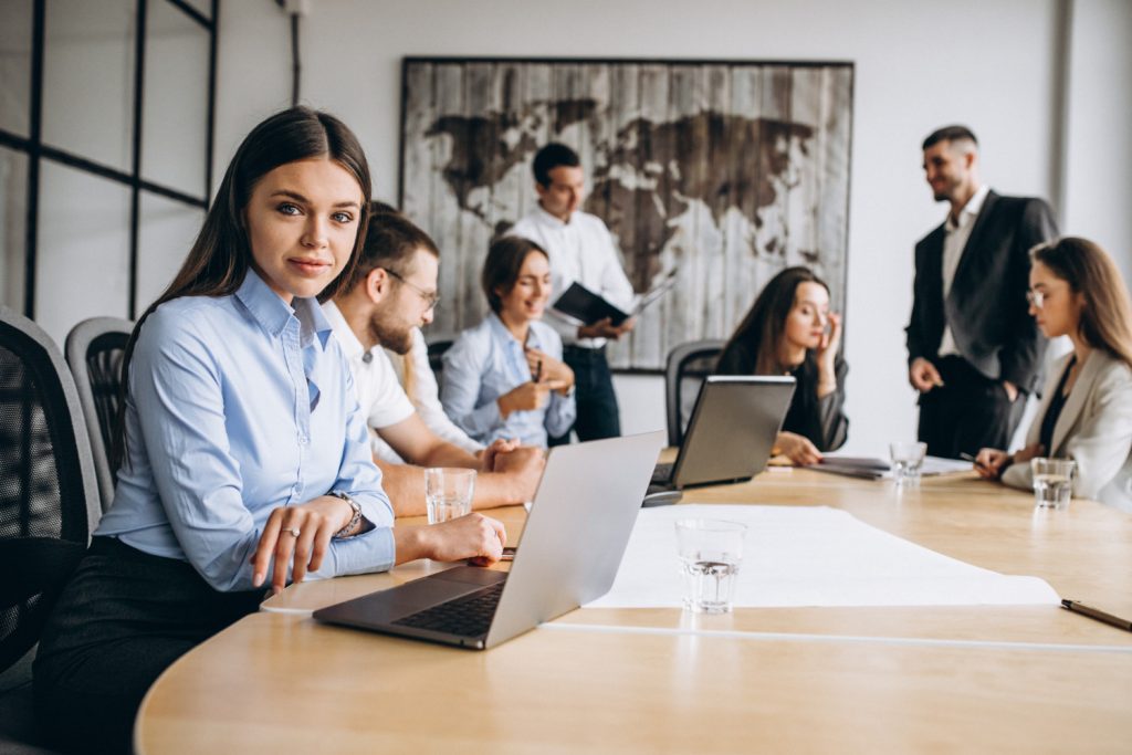 Business professionals collaborating on employee benefits plan, payroll savings strategies, and financial planning in a modern office