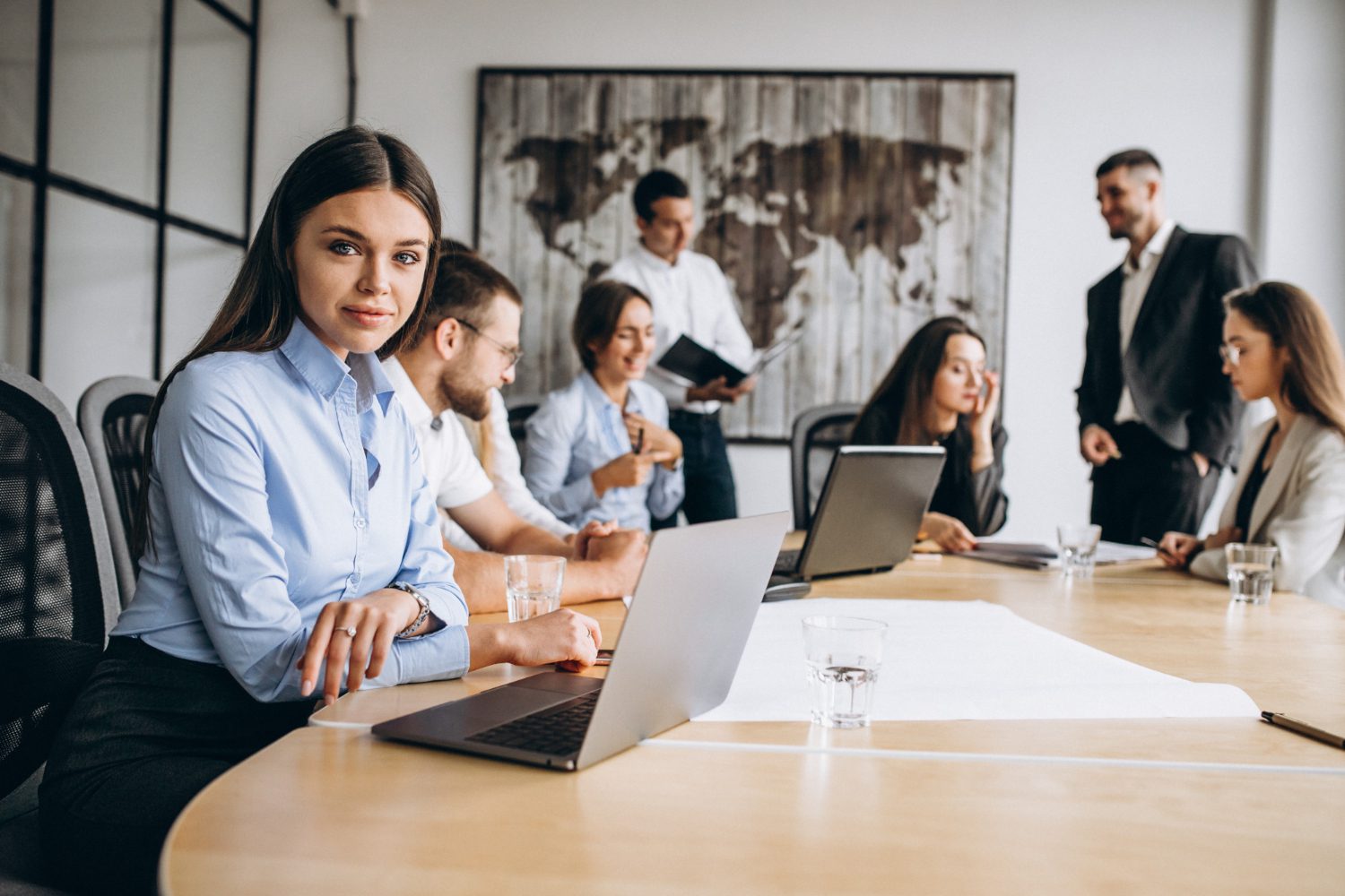Business professionals collaborating on employee benefits plan, payroll savings strategies, and financial planning in a modern office